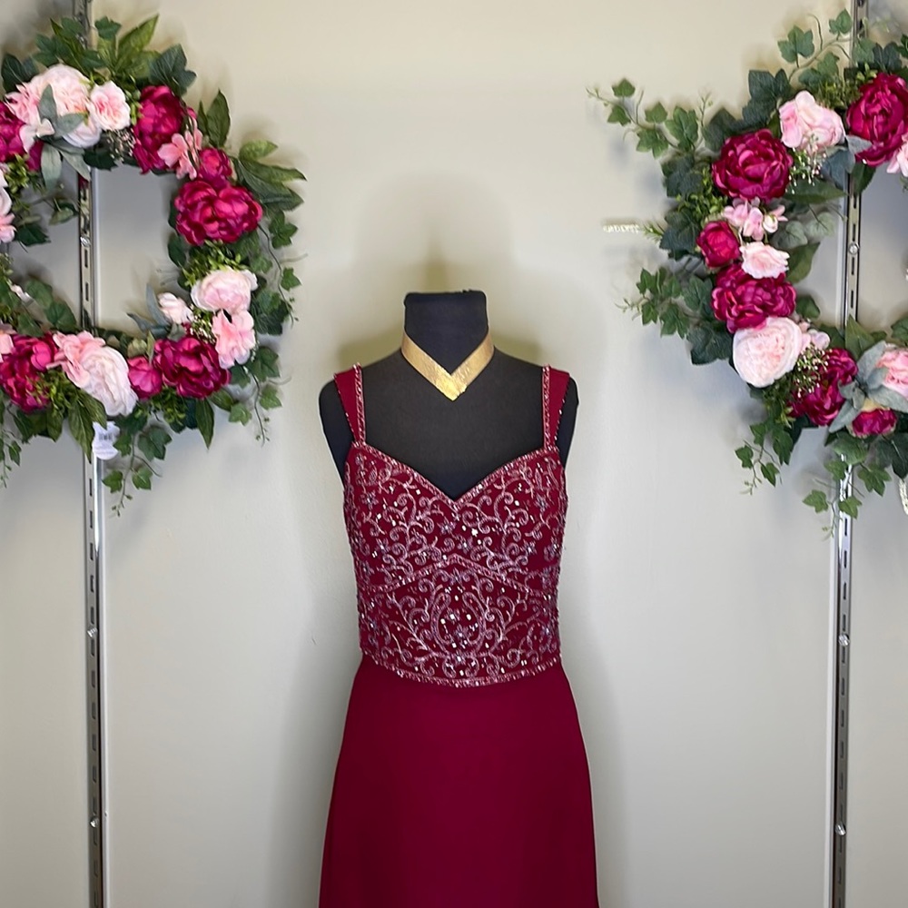 A gorgeous maroon Cameron Bloke by Mon Cheri in size 10 is up for grabs!